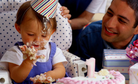 Baby eating Birthday Cake